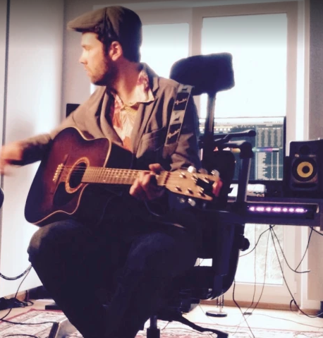 Tobi Vogel is writing songs in his studio